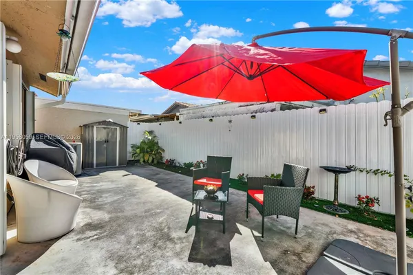 a backyard of a house with seating space