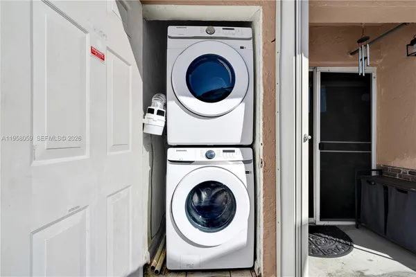 a utility room with dryer and washer