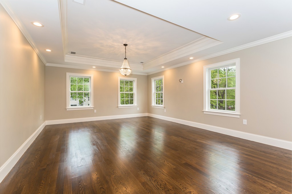 14 Jackson Road Wellesley, MA 02481 - Photo 14 of 28 a view of an empty room with wooden floor and a window