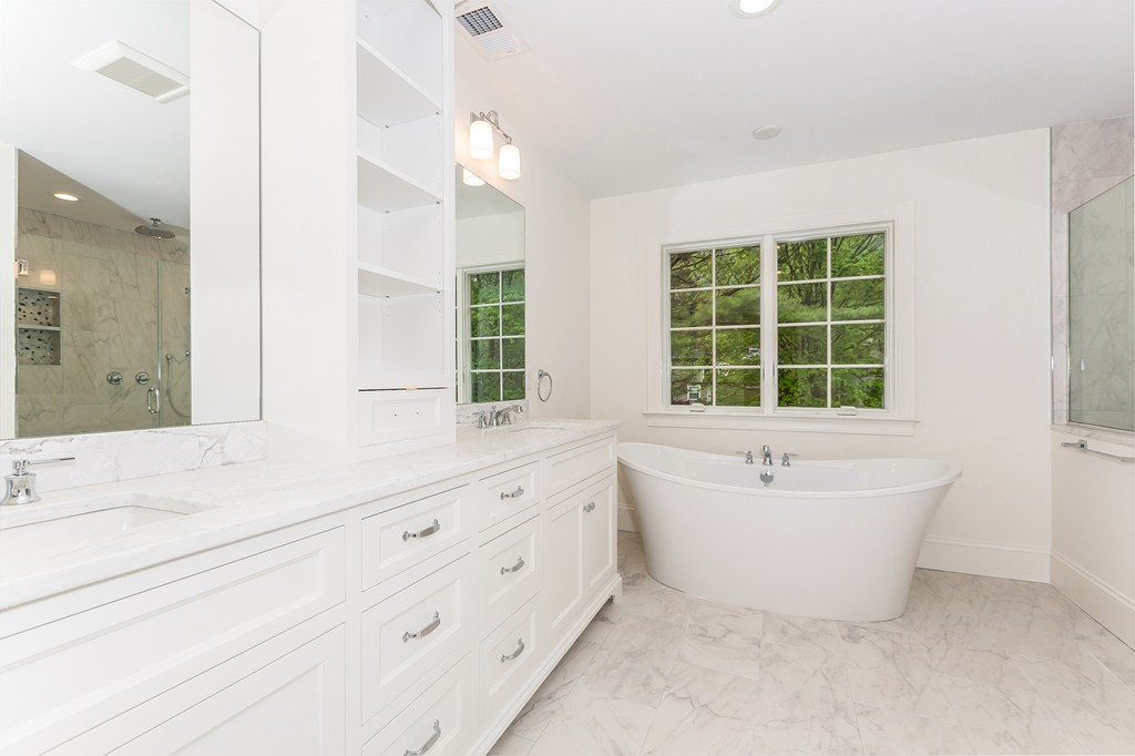 14 Jackson Road Wellesley, MA 02481 - Photo 16 of 28 a bathroom with a bathtub sink and mirror