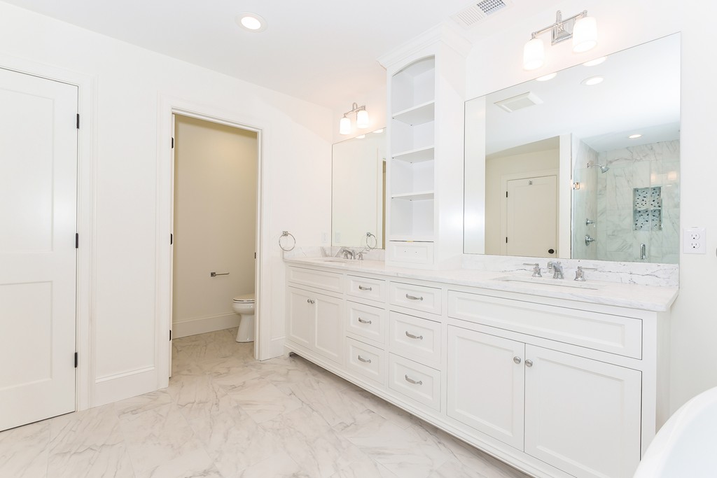14 Jackson Road Wellesley, MA 02481 - Photo 17 of 28 a bathroom with a granite countertop sink mirror and