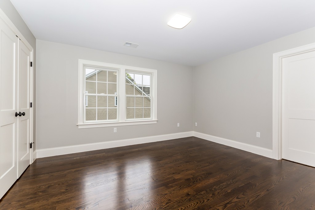14 Jackson Road Wellesley, MA 02481 - Photo 18 of 28 an empty room with wooden floor and windows