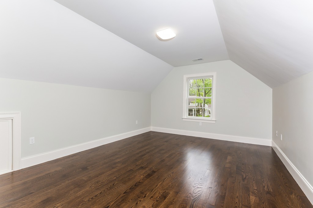 14 Jackson Road Wellesley, MA 02481 - Photo 20 of 28 an empty room with wooden floor and windows