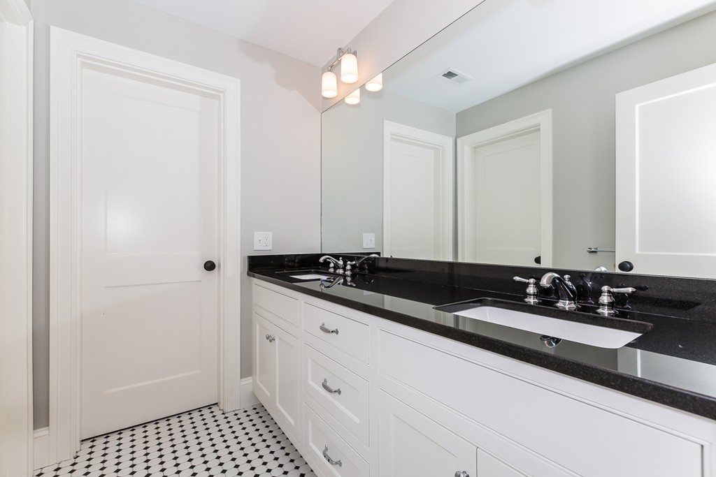 14 Jackson Road Wellesley, MA 02481 - Photo 22 of 28 a bathroom with a sink and a mirror