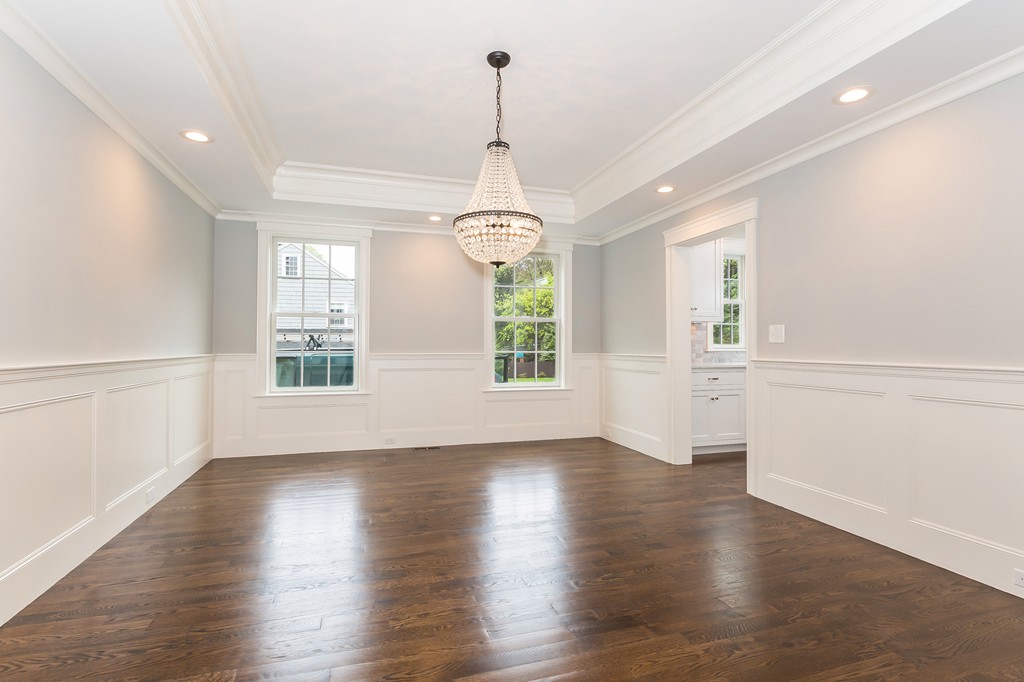 14 Jackson Road Wellesley, MA 02481 - Photo 4 of 28 an empty room with wooden floors windows and entrance