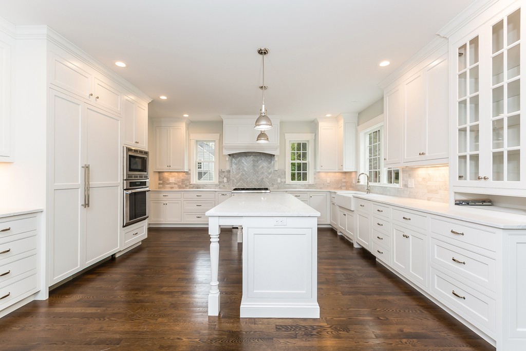 14 Jackson Road Wellesley, MA 02481 - Photo 6 of 28 a large kitchen with white cabinets and stainless steel appliances