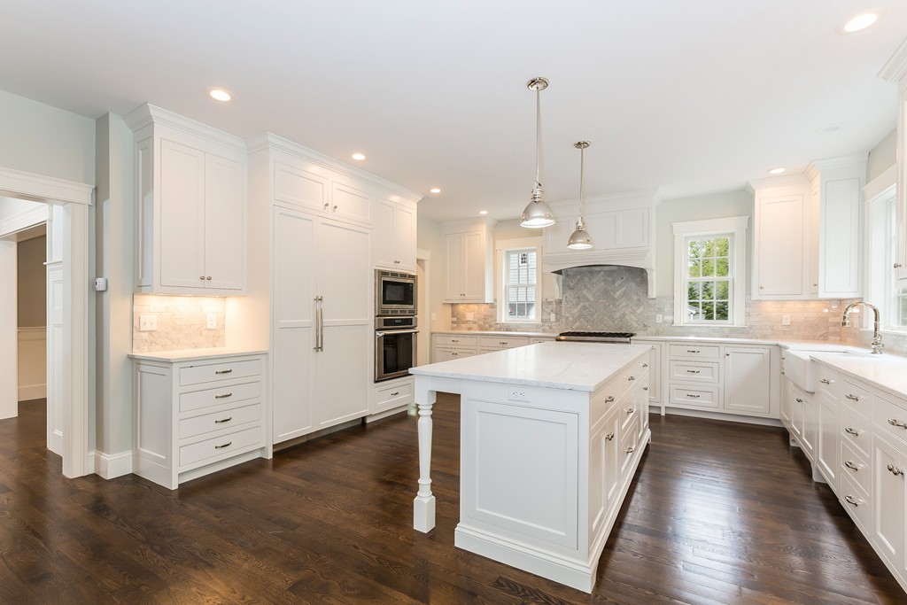 14 Jackson Road Wellesley, MA 02481 - Photo 8 of 28 a large kitchen with white cabinets and wooden floor