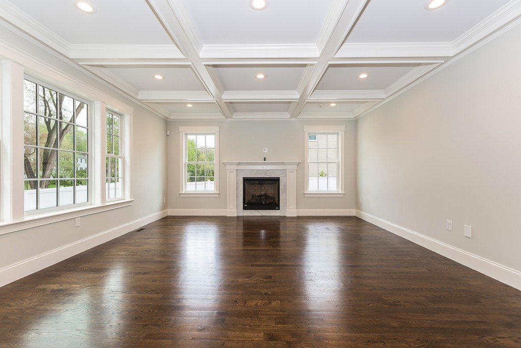 14 Jackson Road Wellesley, MA 02481 - Photo 9 of 28 an empty room with wooden floor and fireplace
