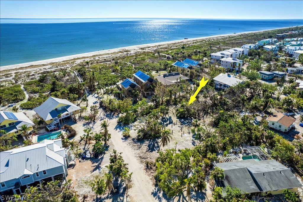 1119 Seagrape Lane Sanibel, FL 33957 - Photo 1 of 13 view of city and ocean