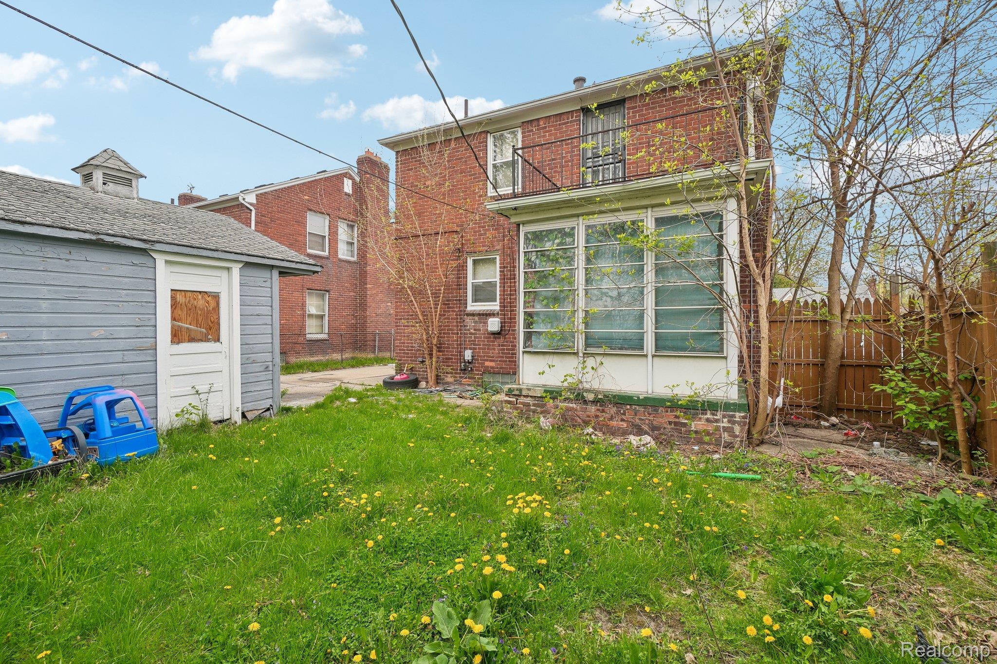 5969 Cadieux Road Detroit, MI 48224 - Photo 23 of 24 Rear view of property with brick siding