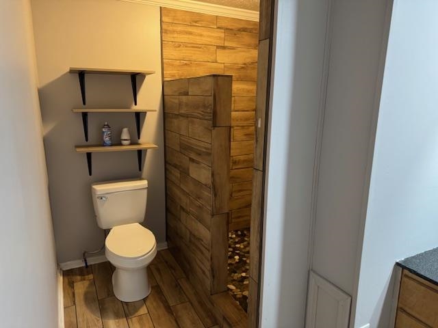 320 Rabbit Ranch Road Henderson, TN 38340 - Photo 18 of 29 Walk-in shower with wood-finish tile surround, pebble flooring, and built-in shelving