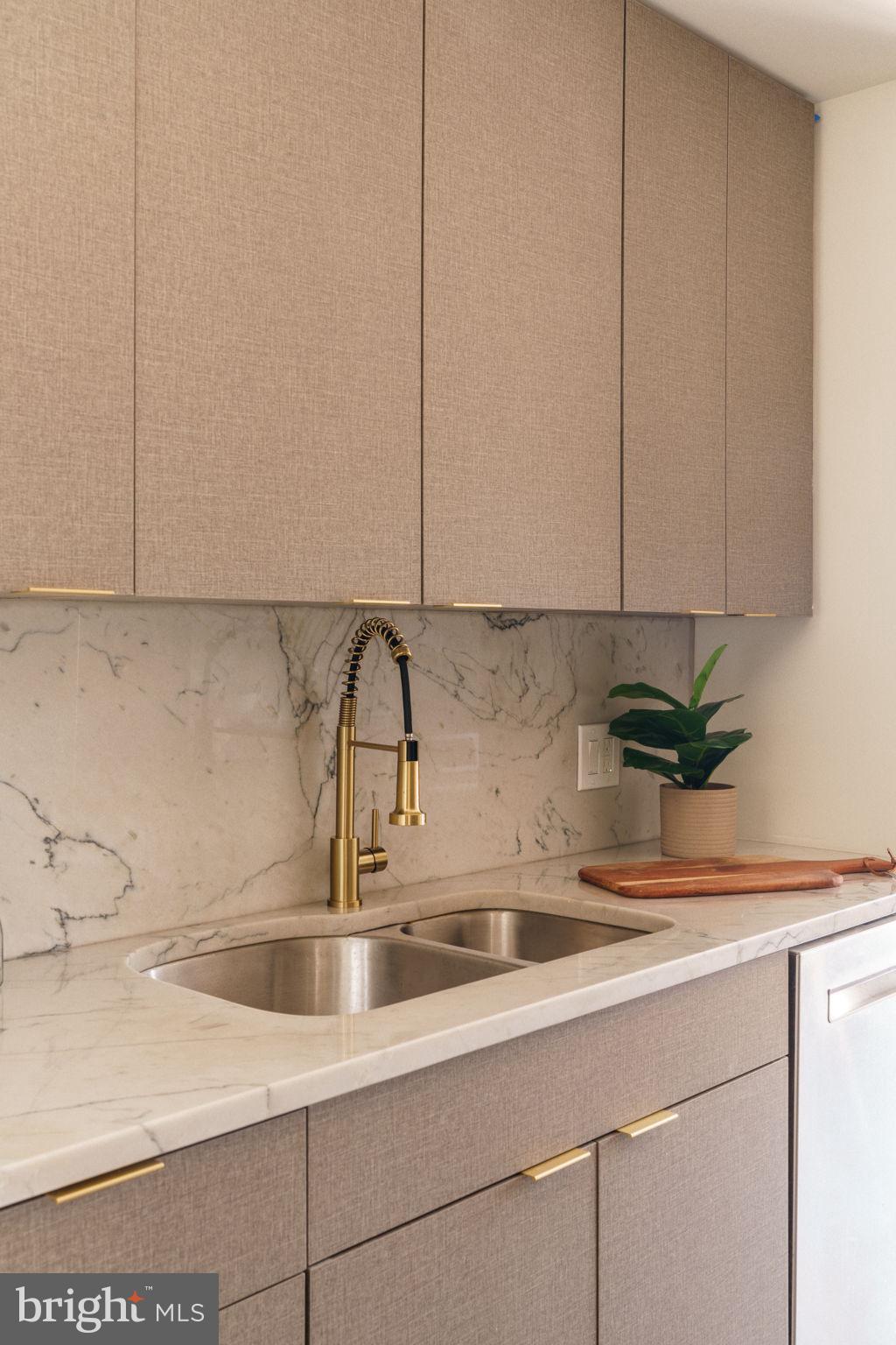 2018-32 Walnut Street, Unit 16GH Philadelphia, PA 19103 - Photo 15 of 78 a kitchen with a sink and cabinets