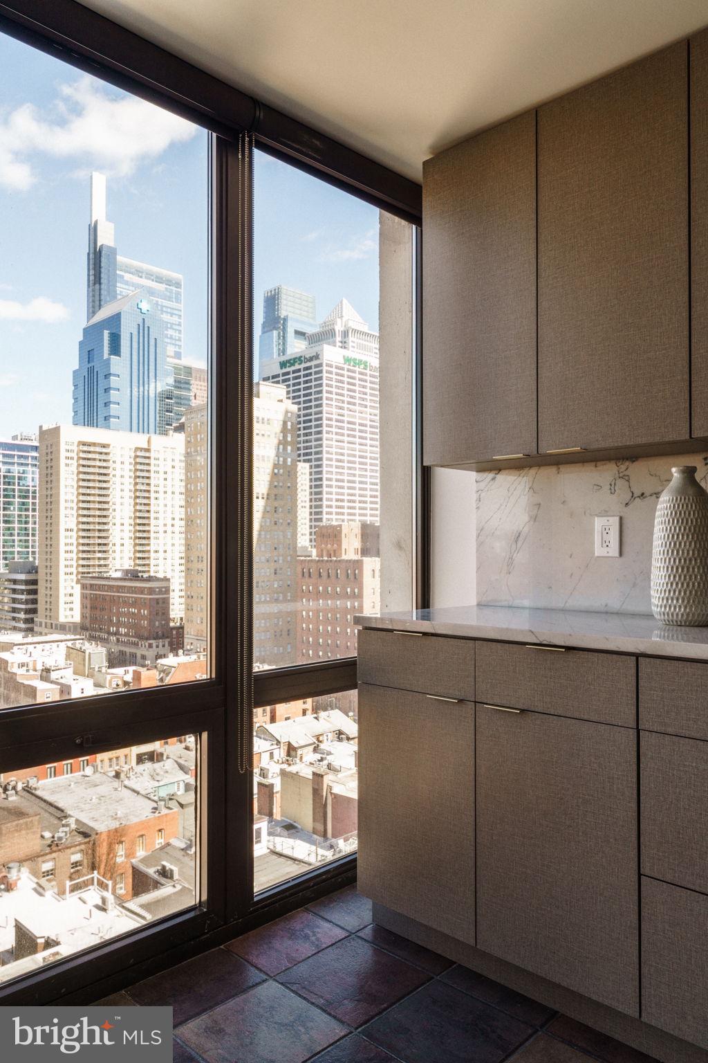 2018-32 Walnut Street, Unit 16GH Philadelphia, PA 19103 - Photo 18 of 78 a kitchen with stainless steel appliances wooden cabinets and a large window