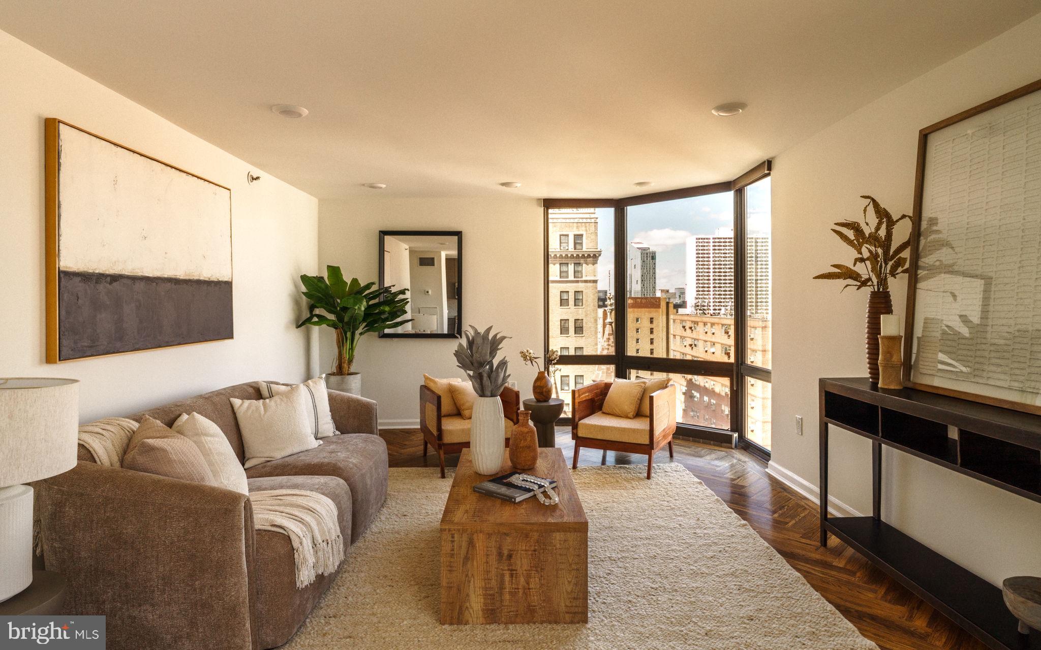 2018-32 Walnut Street, Unit 16GH Philadelphia, PA 19103 - Photo 2 of 78 a living room with furniture and floor to ceiling windows