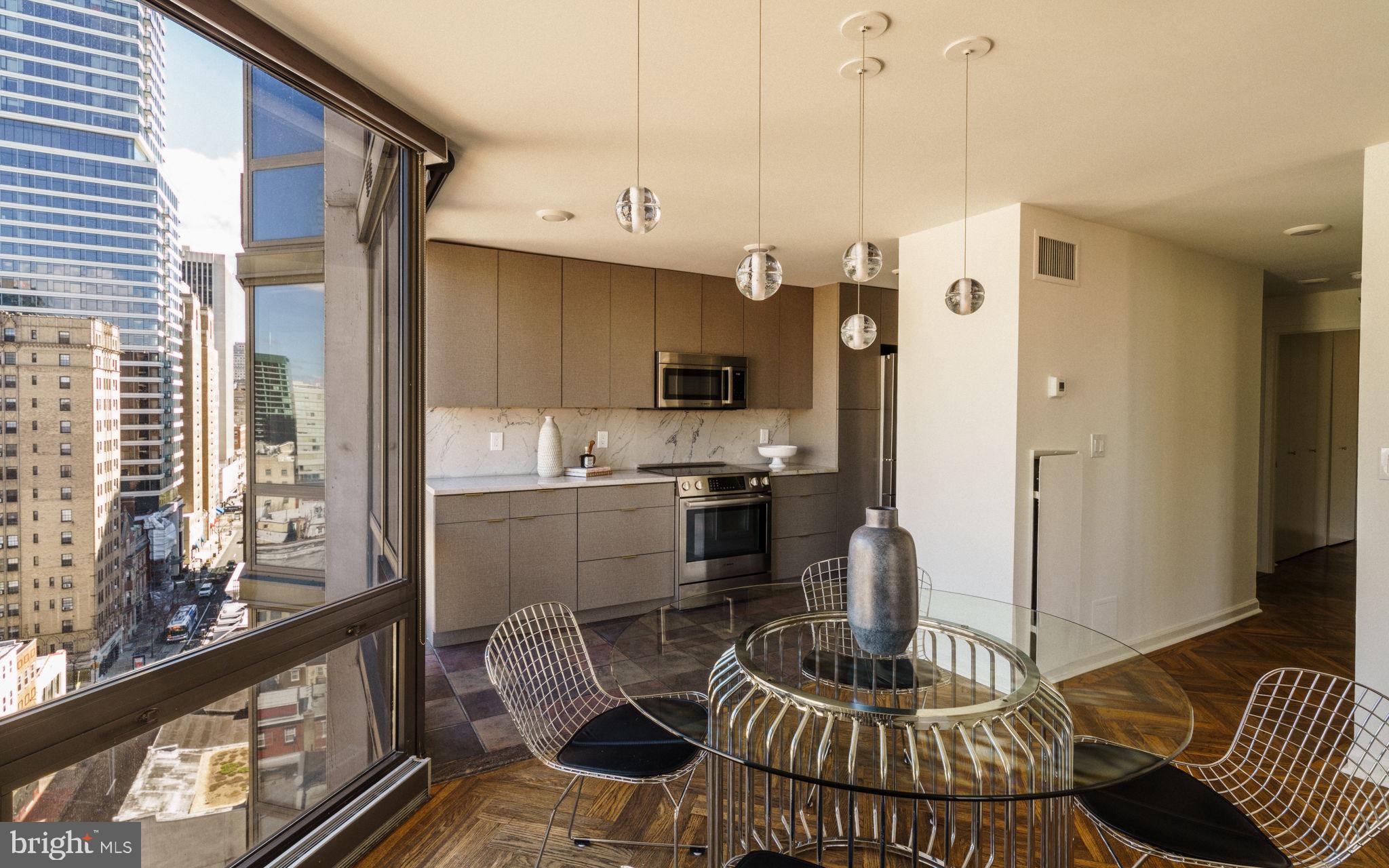 2018-32 Walnut Street, Unit 16GH Philadelphia, PA 19103 - Photo 23 of 78 a kitchen with a refrigerator a stove and a wooden cabinets