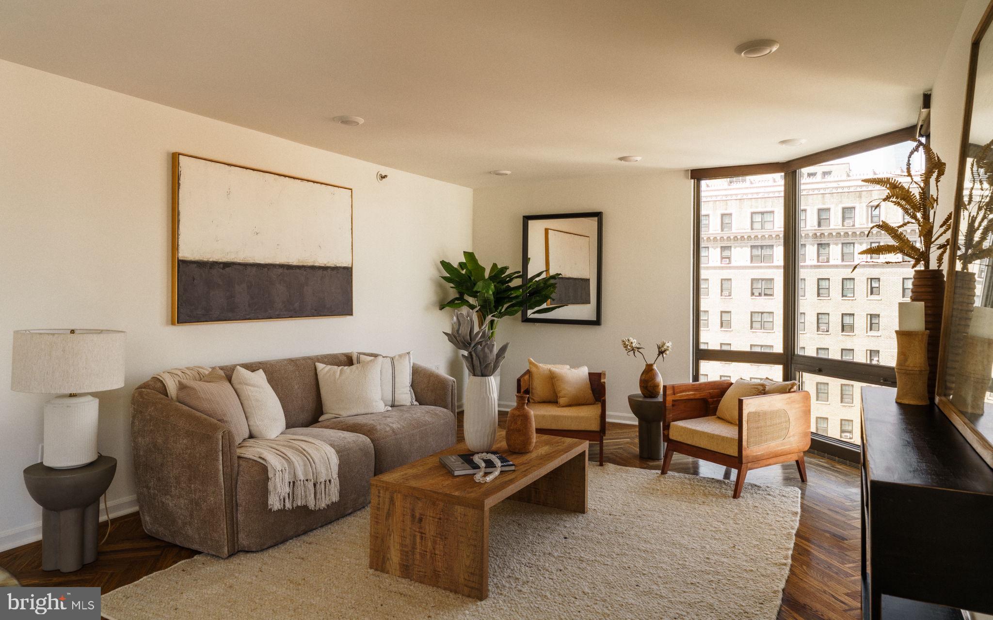 2018-32 Walnut Street, Unit 16GH Philadelphia, PA 19103 - Photo 25 of 78 a living room with furniture and a large window