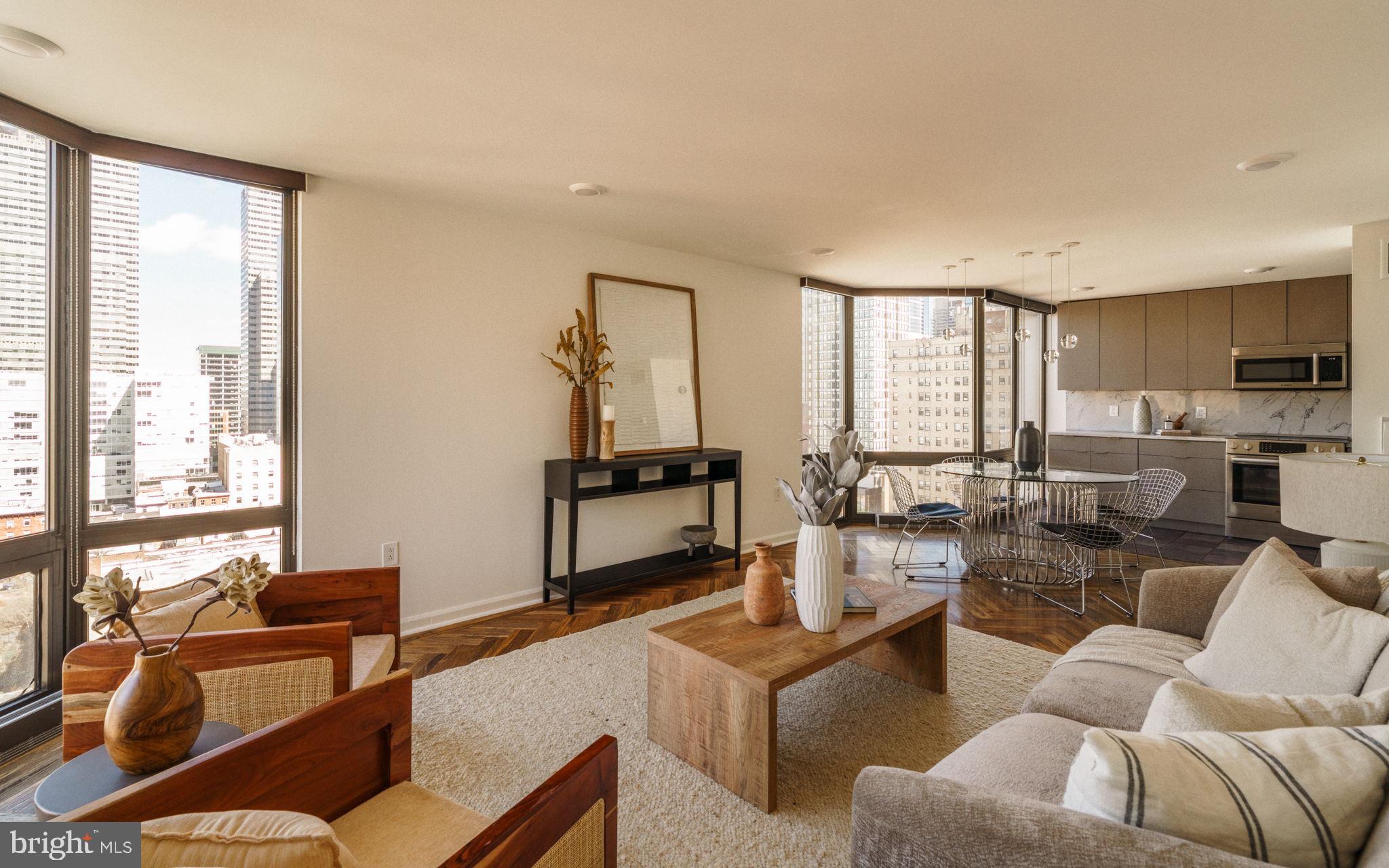 2018-32 Walnut Street, Unit 16GH Philadelphia, PA 19103 - Photo 28 of 78 a living room with furniture and a large window