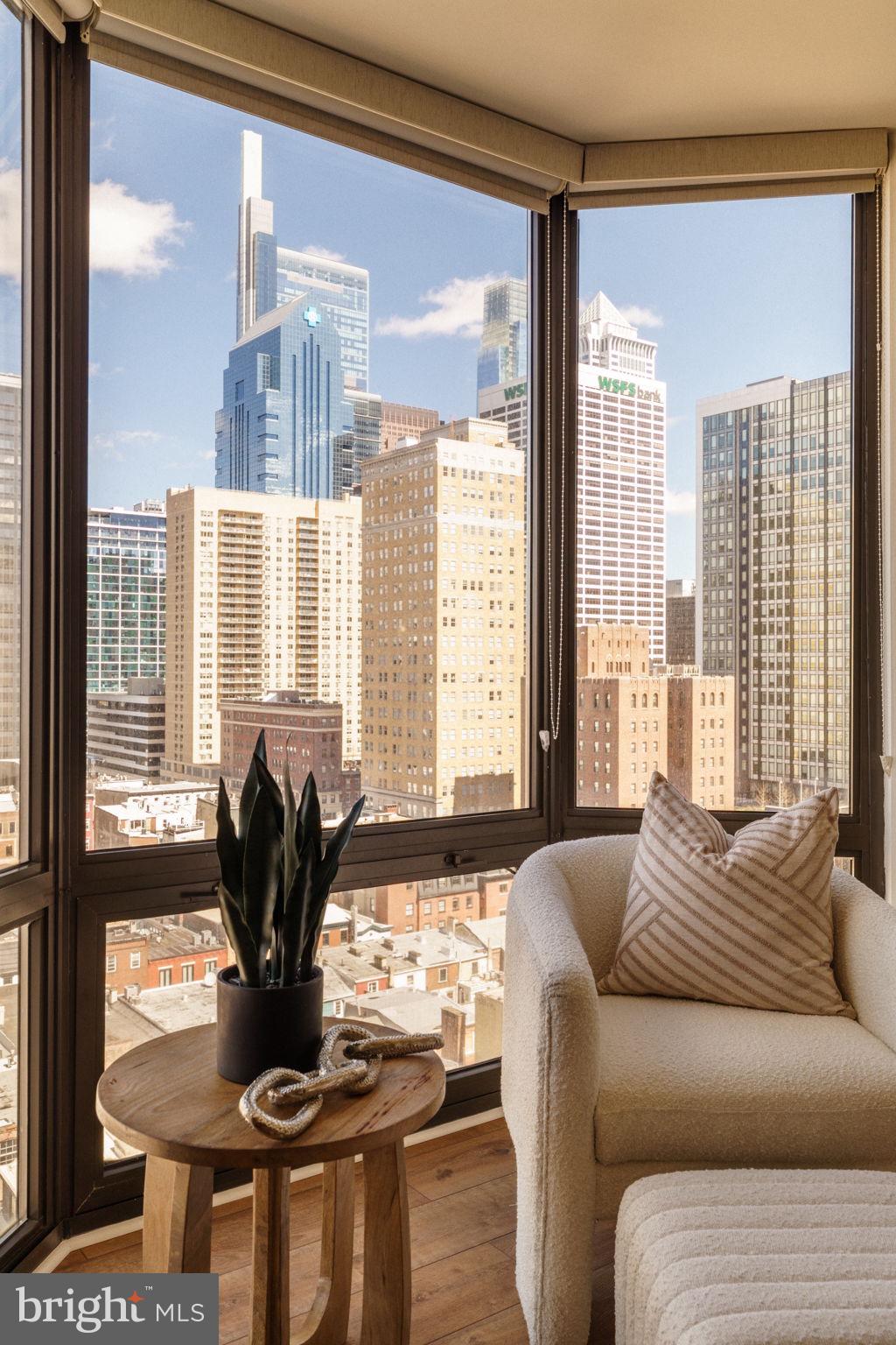 2018-32 Walnut Street, Unit 16GH Philadelphia, PA 19103 - Photo 31 of 78 a living room with furniture and a large window