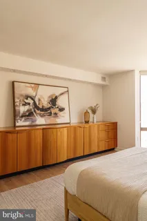 a view of hallway with furniture and a window