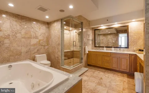 a bathroom with a shower and a shower