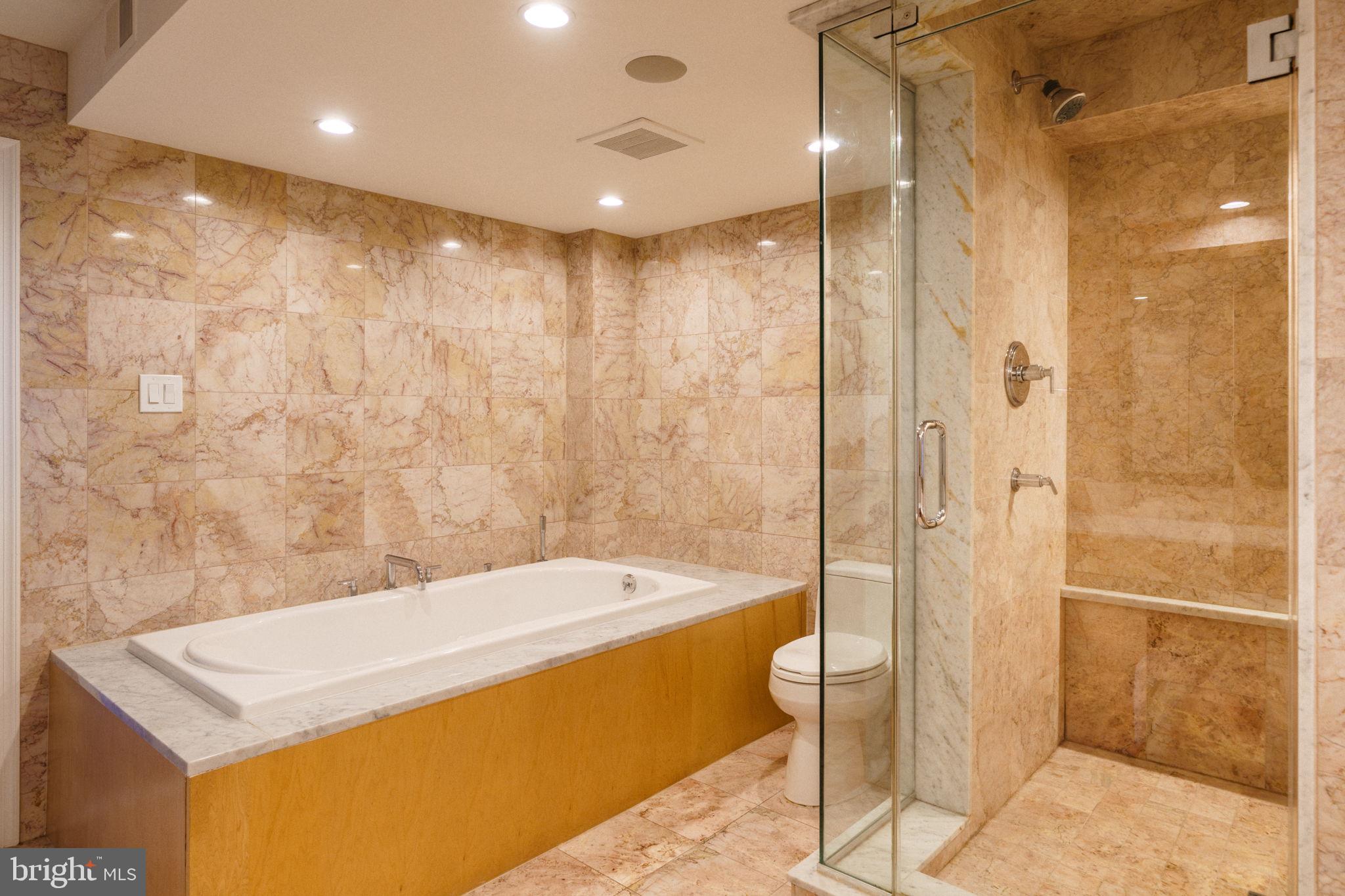 2018-32 Walnut Street, Unit 16GH Philadelphia, PA 19103 - Photo 41 of 78 a bathroom with a tub a sink and shower