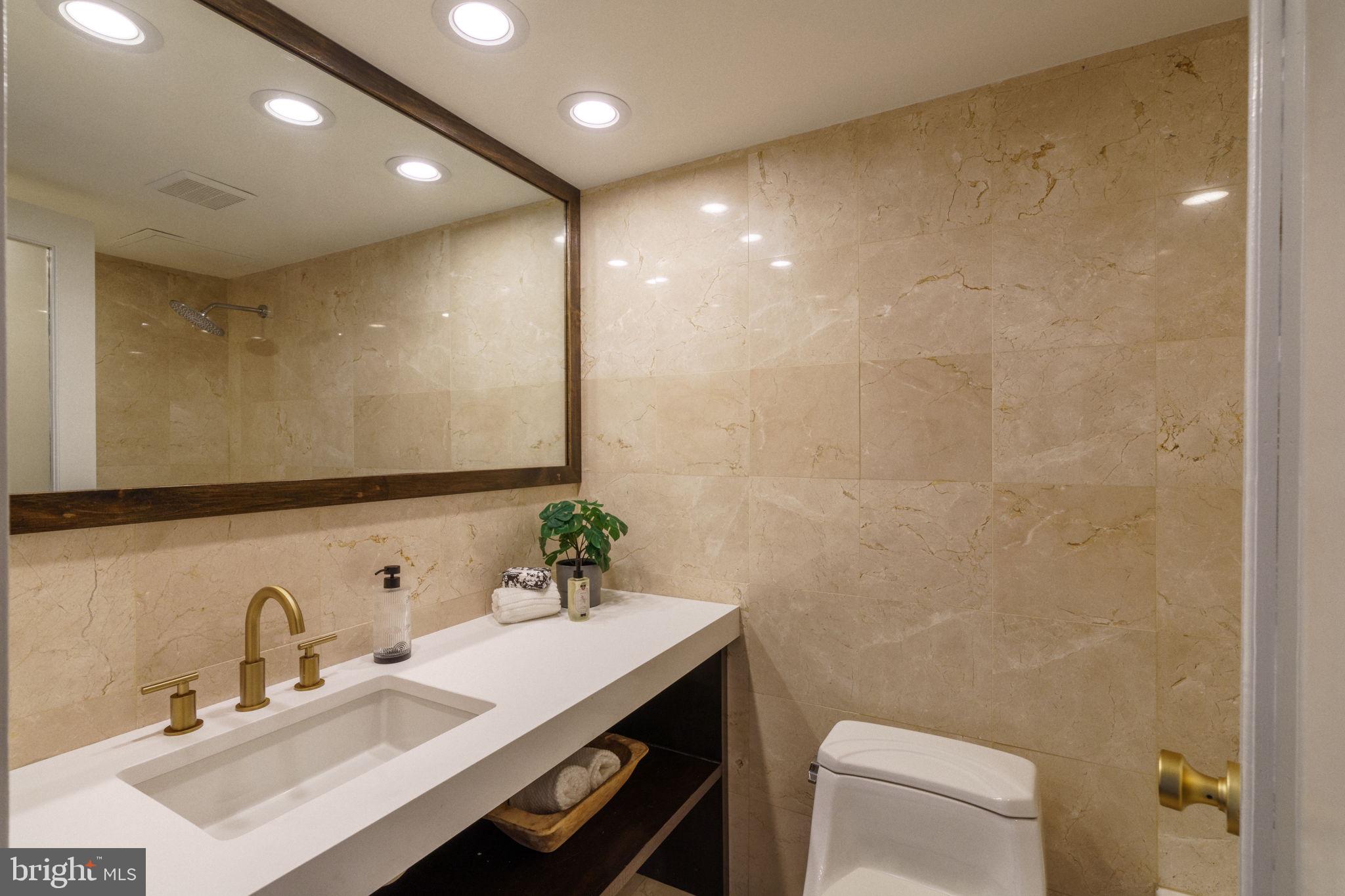 2018-32 Walnut Street, Unit 16GH Philadelphia, PA 19103 - Photo 50 of 78 a bathroom with a sink vanity granite and toilet