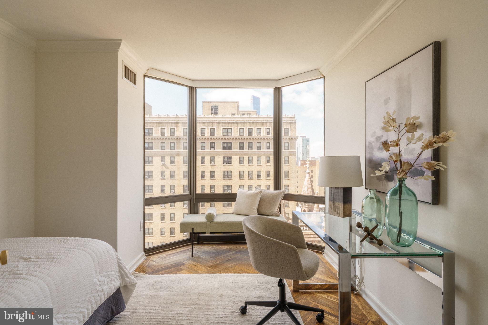 2018-32 Walnut Street, Unit 16GH Philadelphia, PA 19103 - Photo 5 of 78 a living room with furniture and a floor to ceiling window