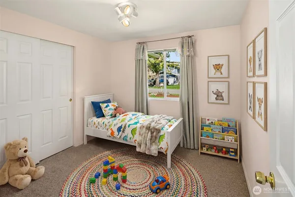 a bedroom with a bed and a couch