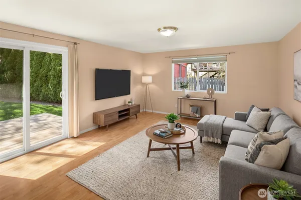 a living room with furniture and a flat screen tv