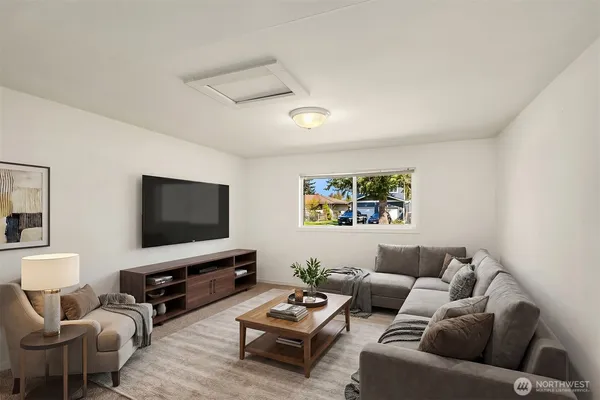 a living room with furniture and a flat screen tv