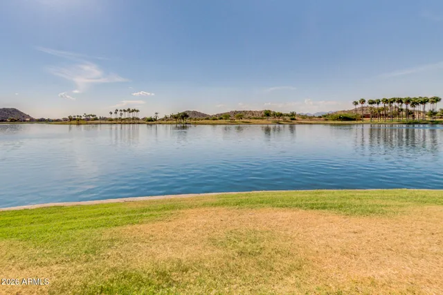 a view of swimming pool with a table and chairs