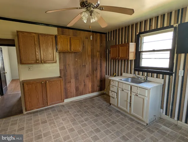 a kitchen with a refrigerator and a sink