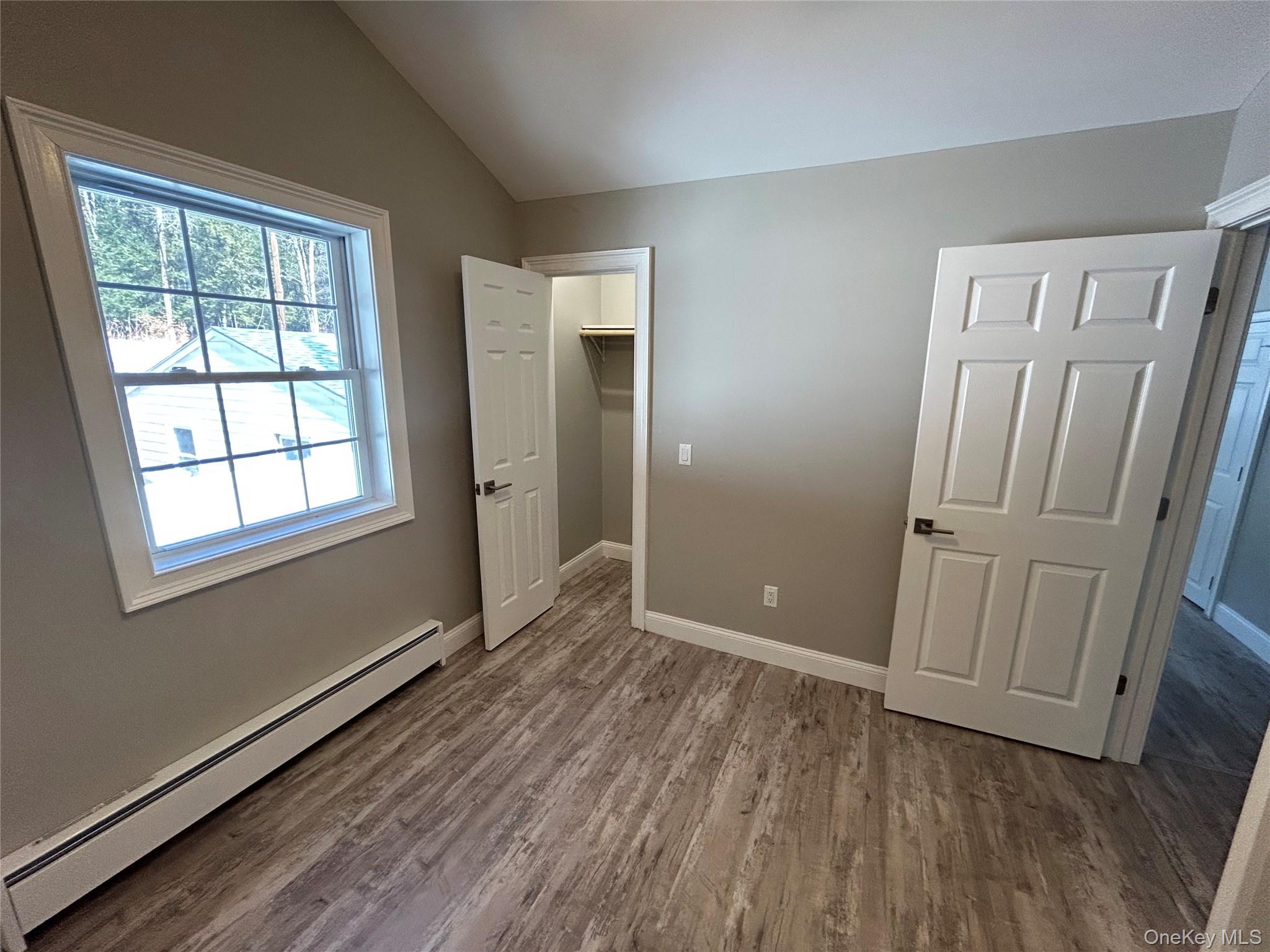 135 Gale Road, Unit UPSTAIRS Mongaup Valley, NY 12762 - Photo 13 of 23 an empty room with wooden floor and windows