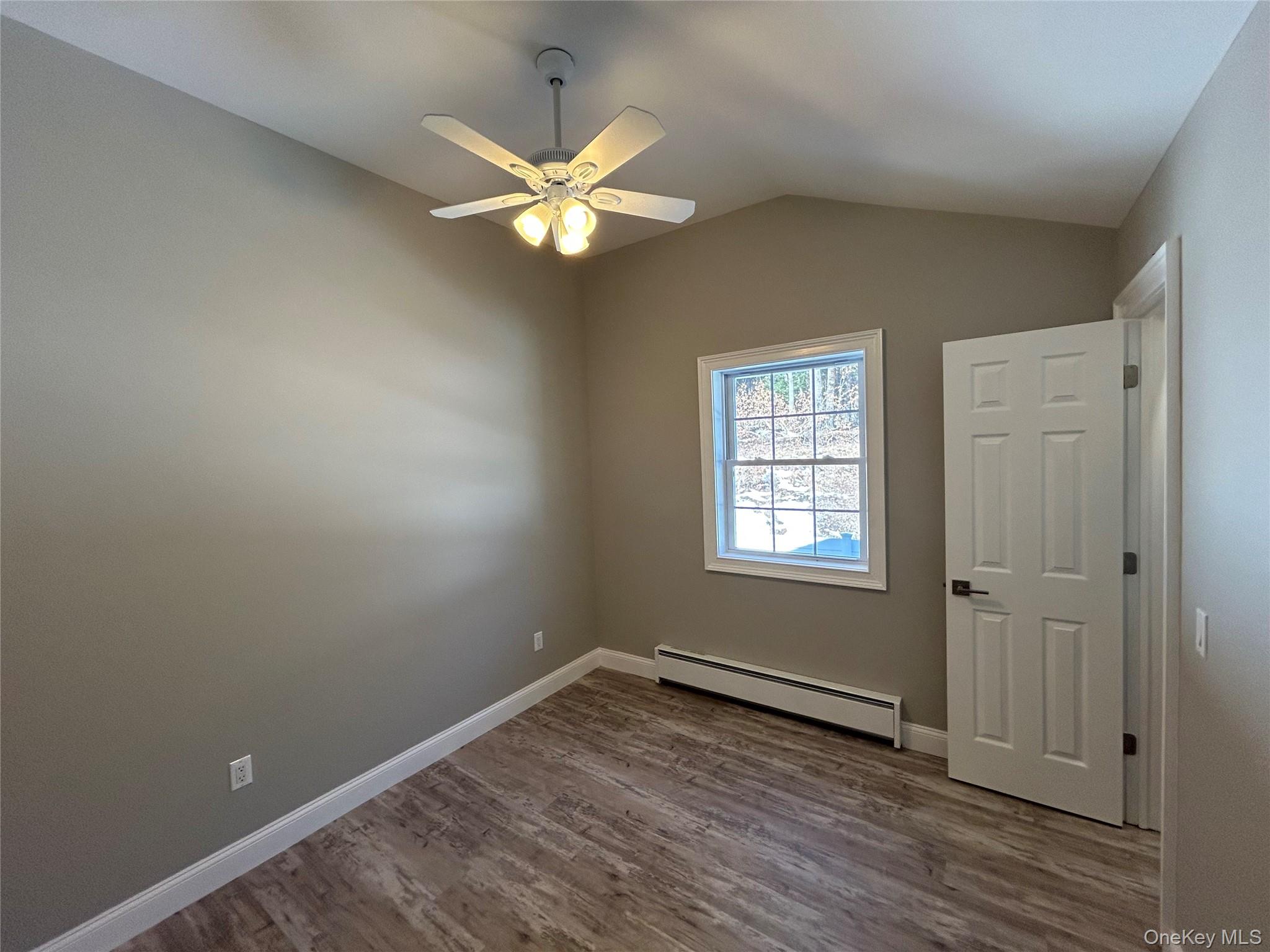 135 Gale Road, Unit UPSTAIRS Mongaup Valley, NY 12762 - Photo 14 of 23 wooden floor in an empty room with a window