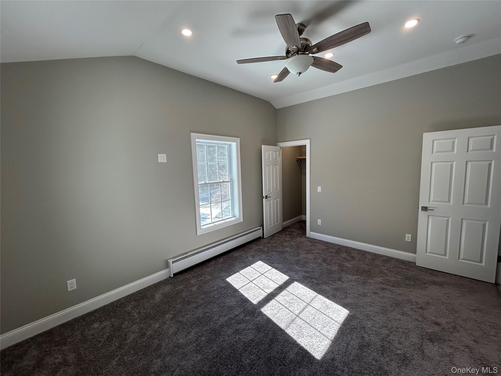 135 Gale Road, Unit UPSTAIRS Mongaup Valley, NY 12762 - Photo 17 of 23 an empty room with windows and fan