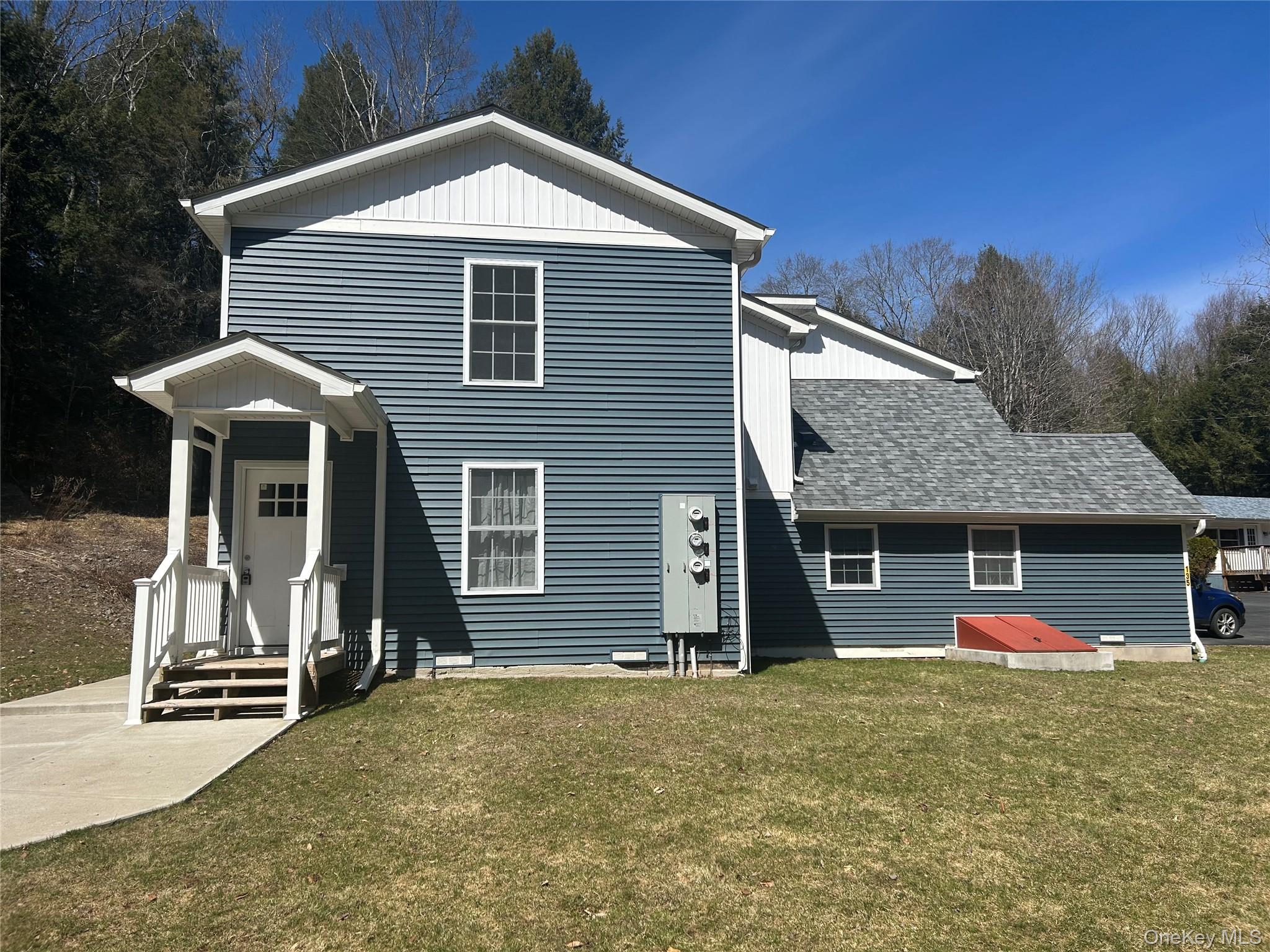135 Gale Road, Unit UPSTAIRS Mongaup Valley, NY 12762 - Photo 2 of 23 a front view of a house with a garage