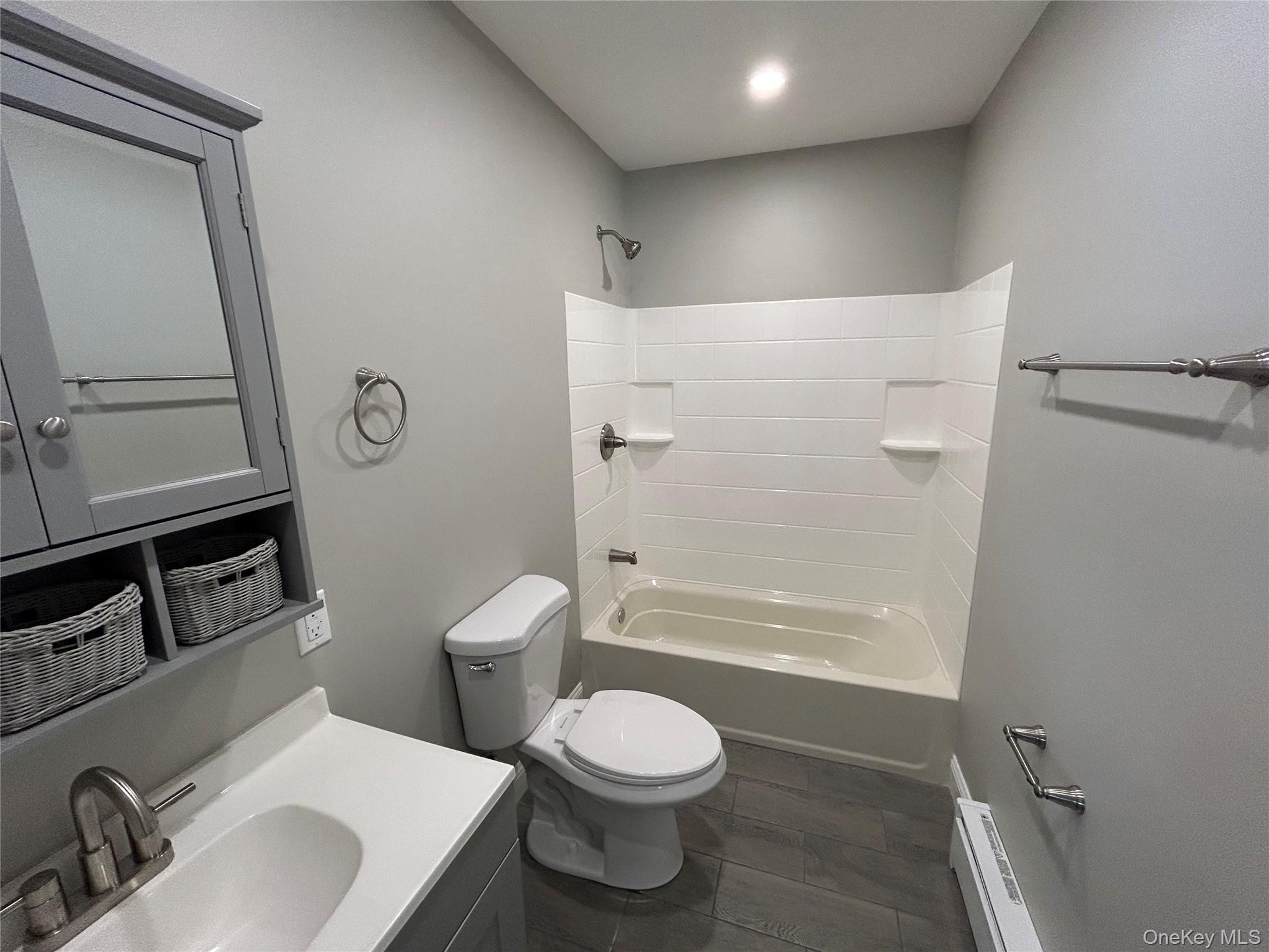 135 Gale Road, Unit UPSTAIRS Mongaup Valley, NY 12762 - Photo 21 of 23 a bathroom with a sink toilet and shower
