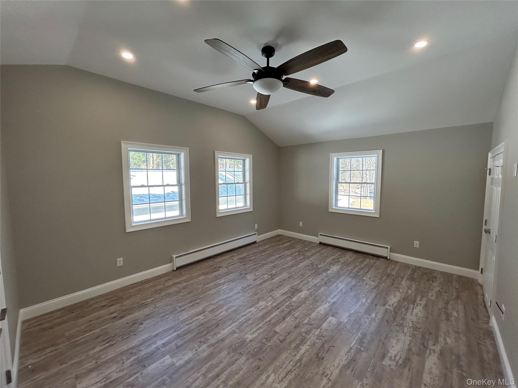 135 Gale Road, Unit UPSTAIRS Mongaup Valley, NY 12762 - Photo 10 of 23 a view of an empty room with wooden floor and a window