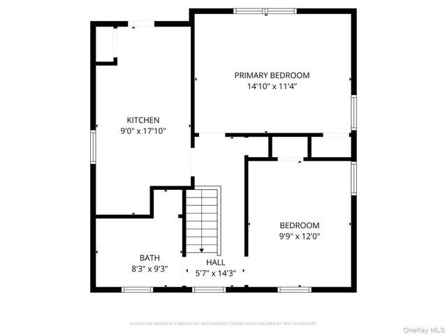 a picture of a bench in front of a wall