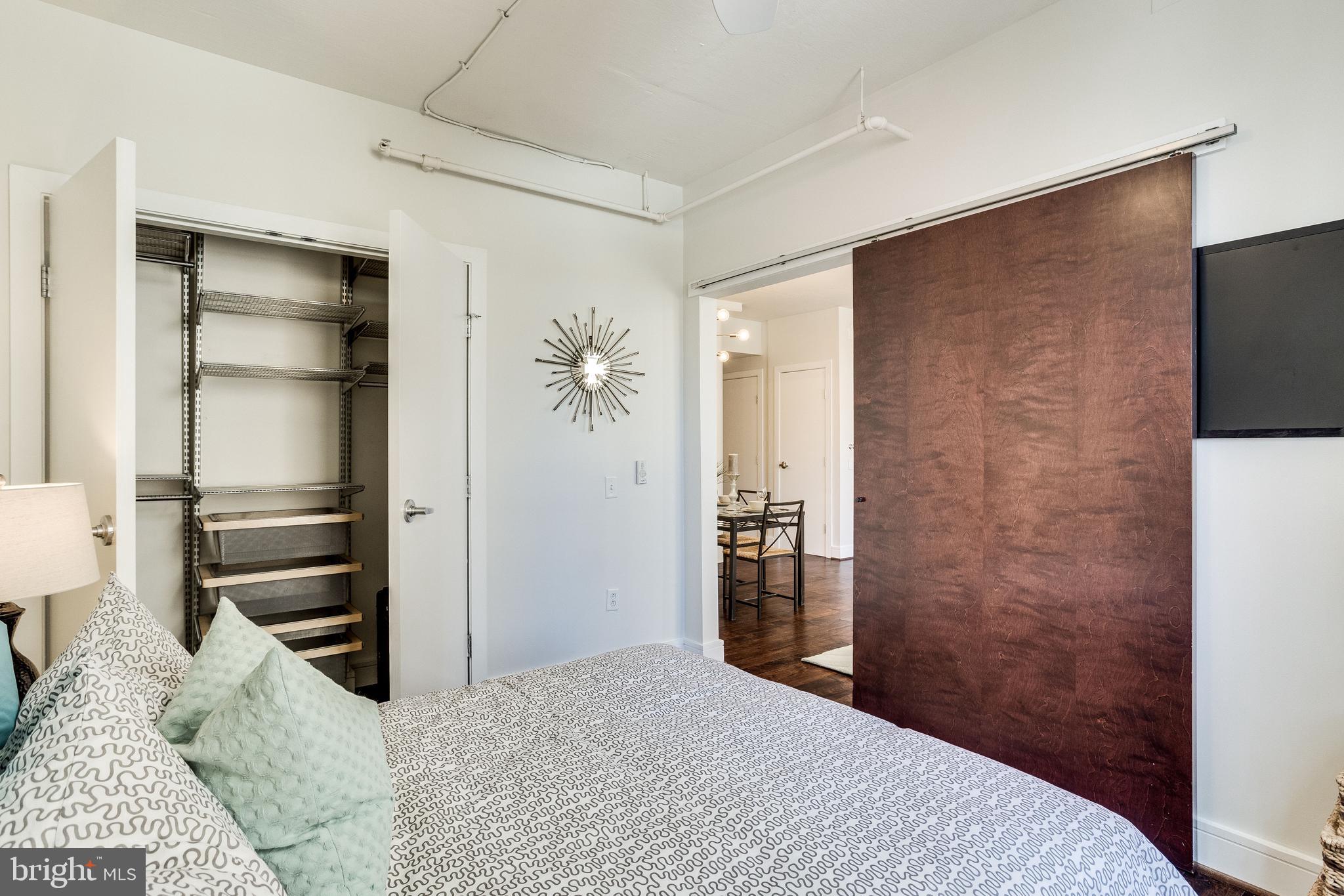 809 6th Street Northwest, Unit 35 Washington, DC 20001 - Photo 12 of 23 Large bedroom with sliding barn doors