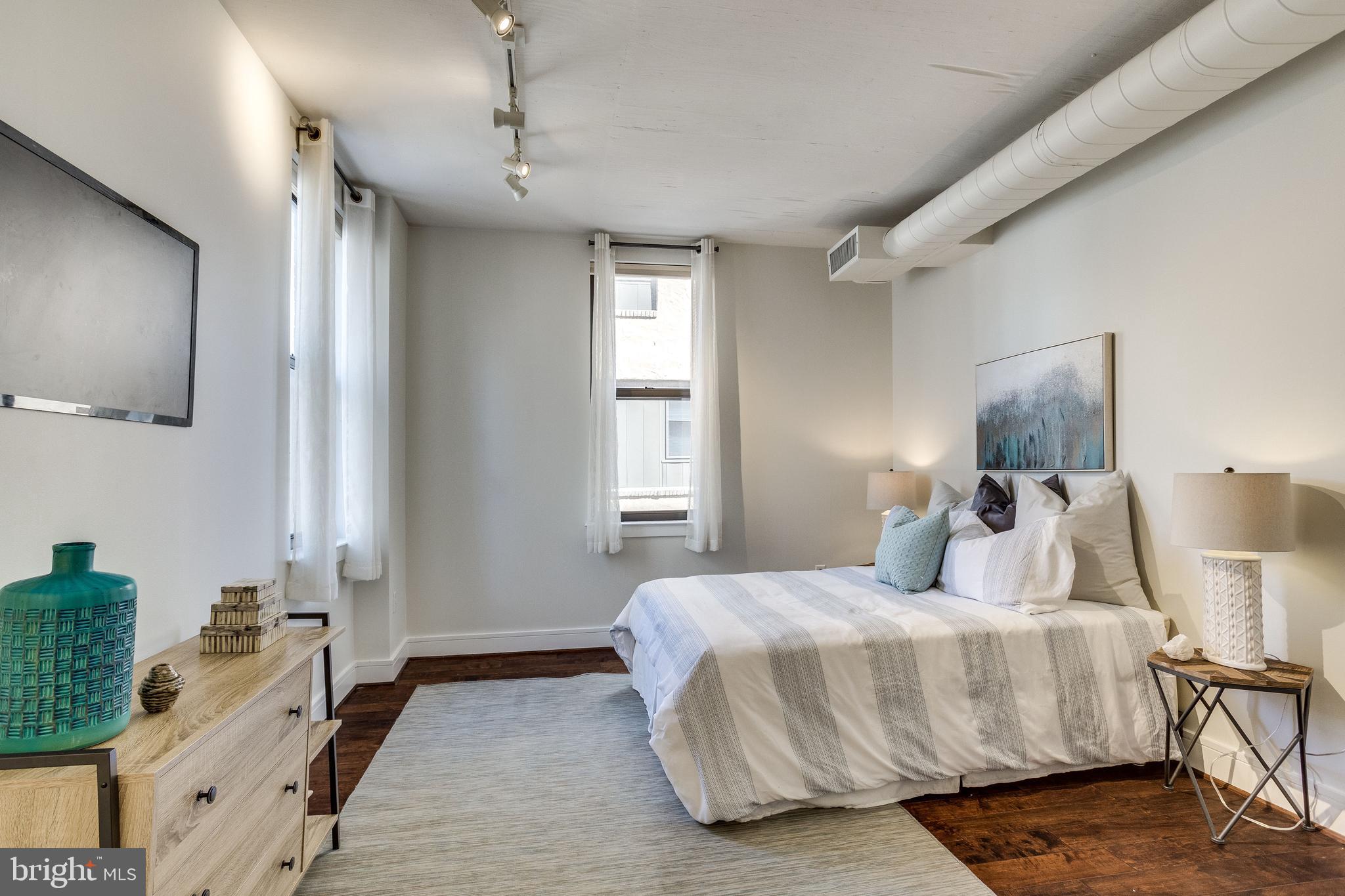 809 6th Street Northwest, Unit 35 Washington, DC 20001 - Photo 17 of 23 High ceilings and concrete accents