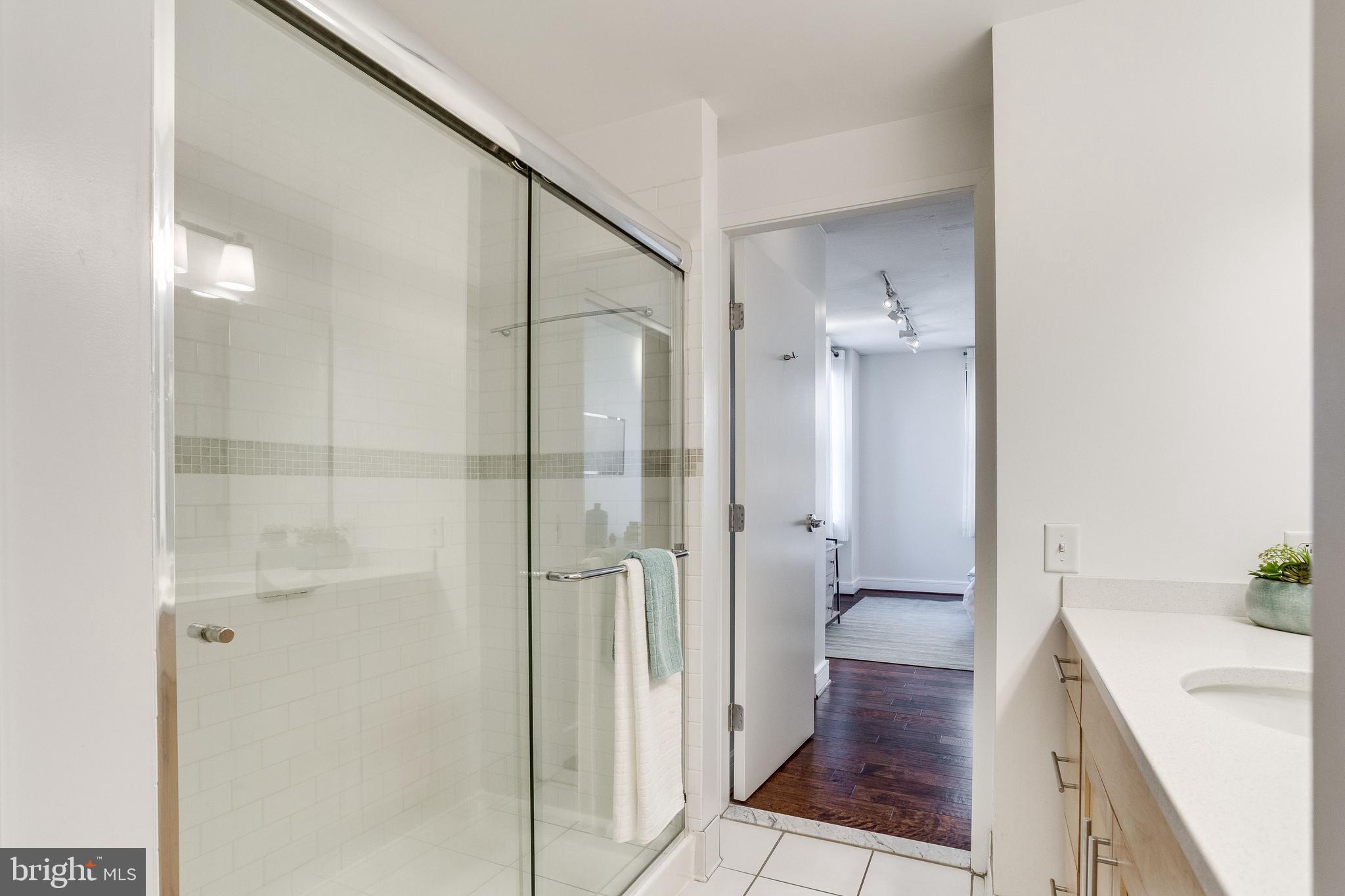 809 6th Street Northwest, Unit 35 Washington, DC 20001 - Photo 20 of 23 Master ensuite w/ glass-enclosed walk-in shower