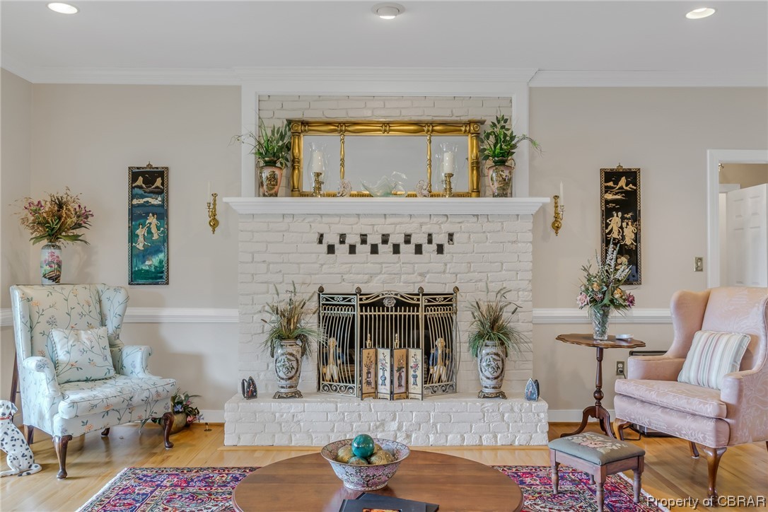 181 Duckbill Road White Stone, VA 22578 - Photo 17 of 50 Hardwood floored living room with crown molding and a fireplace