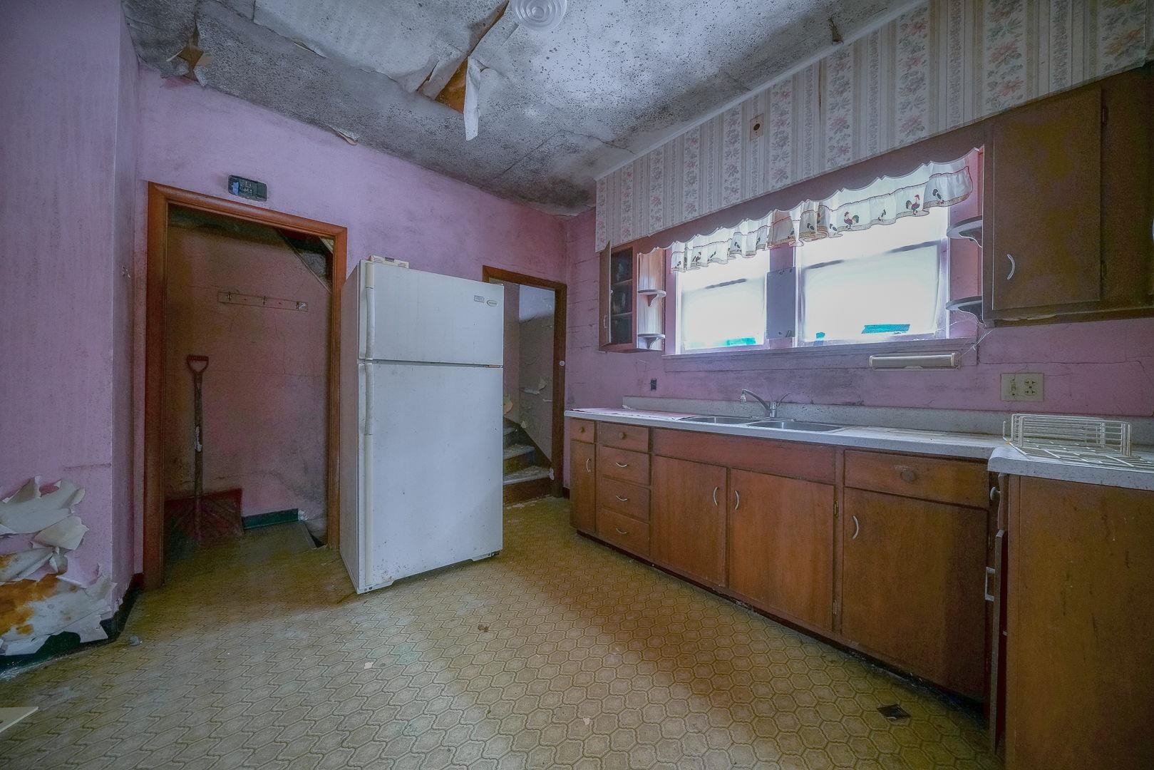 118 North Locust Street Genoa, IL 60135 - Photo 12 of 21 a spacious bathroom with a granite countertop sink and a mirror