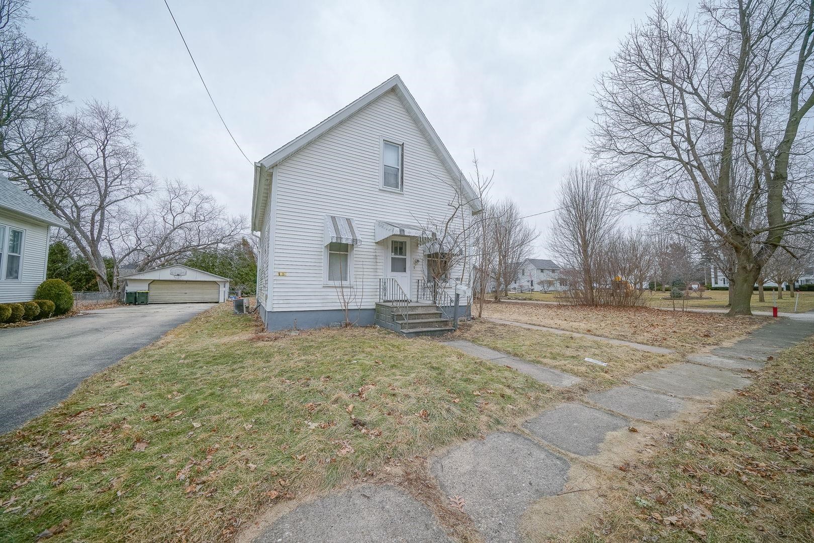 118 North Locust Street Genoa, IL 60135 - Photo 21 of 21 a view of a yard with a house