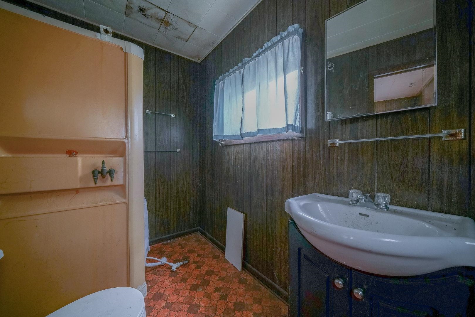 118 North Locust Street Genoa, IL 60135 - Photo 10 of 21 a bathroom with a sink and a mirror