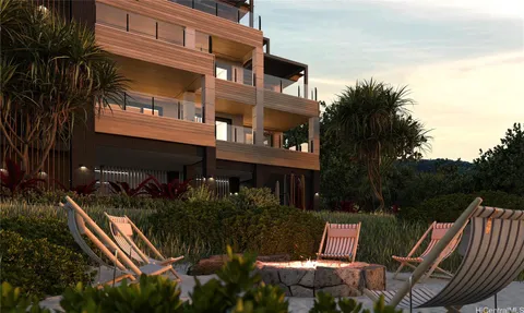 a view of backyard with outdoor seating and plants