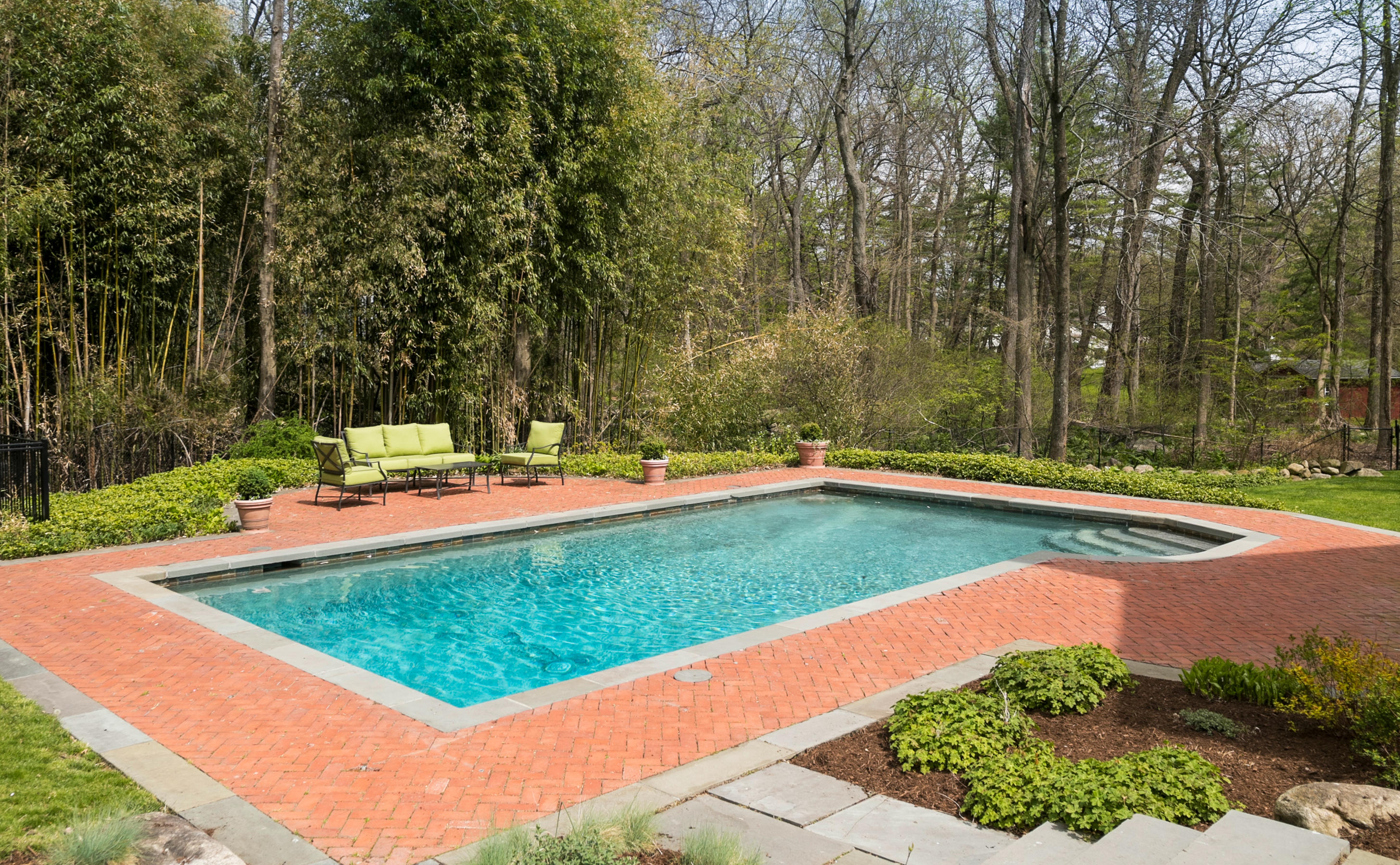 1 Pilgrim Road Darien, CT 06820 - Photo 23 of 26 a view of a swimming pool with a yard