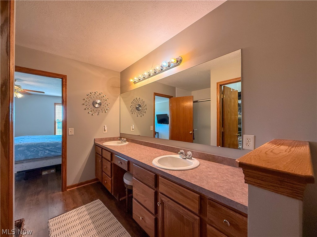 125 Pondview Circle Rittman, OH 44270 - Photo 20 of 38 Primary bathroom view to bedroom