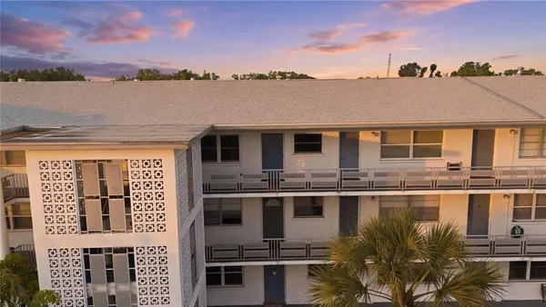 a front view of a building with lake view
